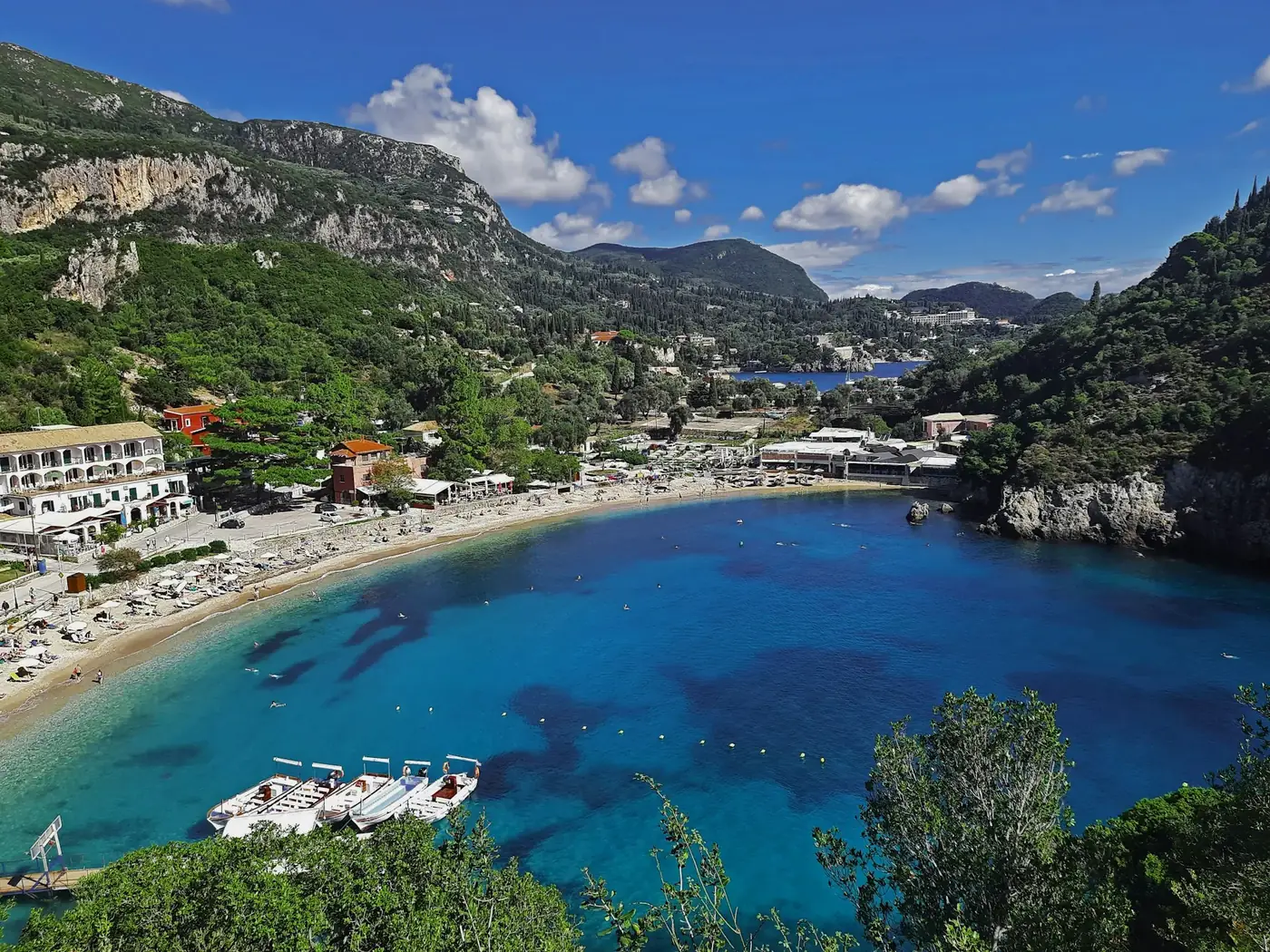 a view of a beach with boats in the water
