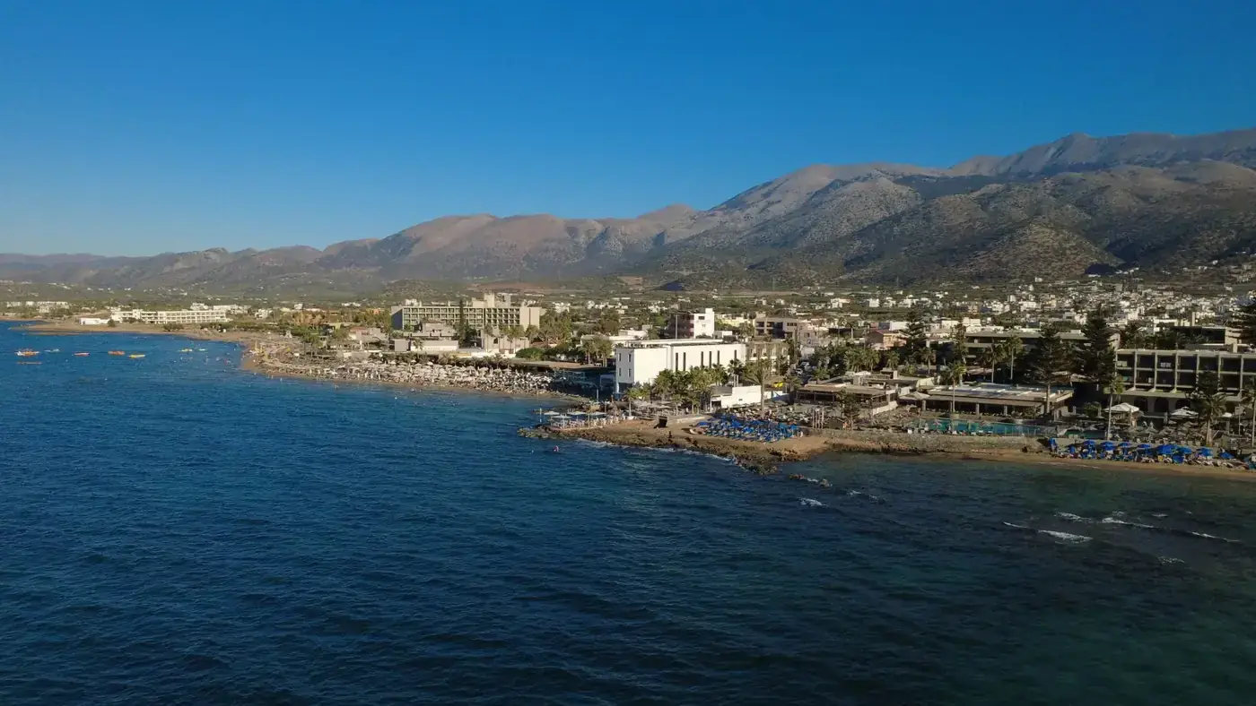 Explore the stunning coastline of Malia, Crete with its clear waters and picturesque landscape.