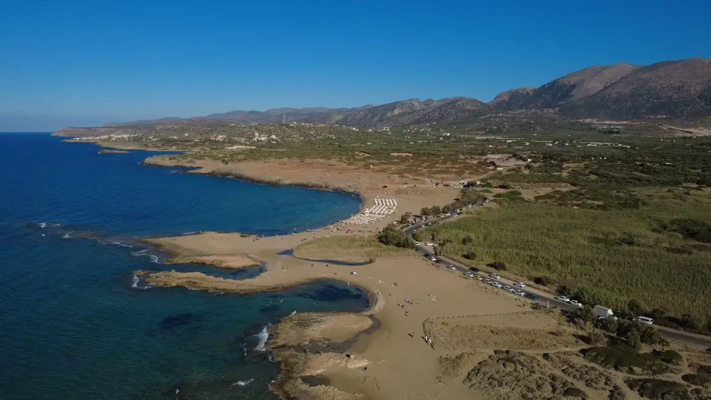 Stunning aerial view of Malia beach, Crete, showcasing the coastline and landscape.
