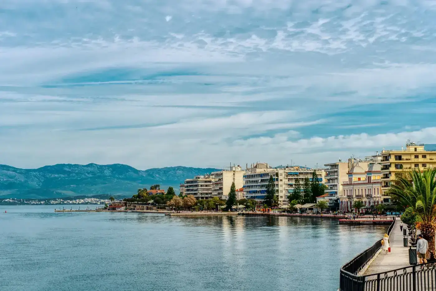 Explore the vibrant Chalkida waterfront promenade in Greece with stunning architecture and serene sea views.