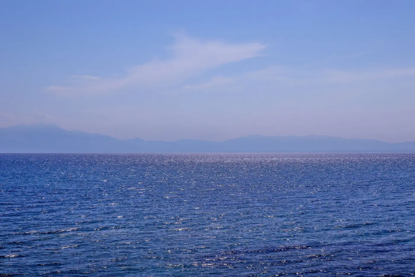 Peaceful ocean view at Nea Irakleia with clear blue skies and a shimmering sea.