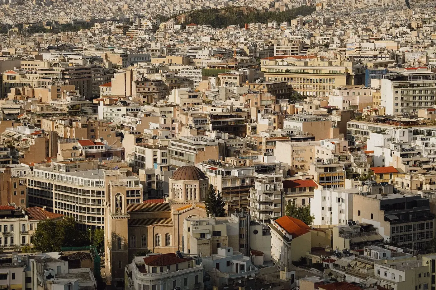 Breathtaking aerial view of Athens cityscape showcasing dense architecture and historic buildings.