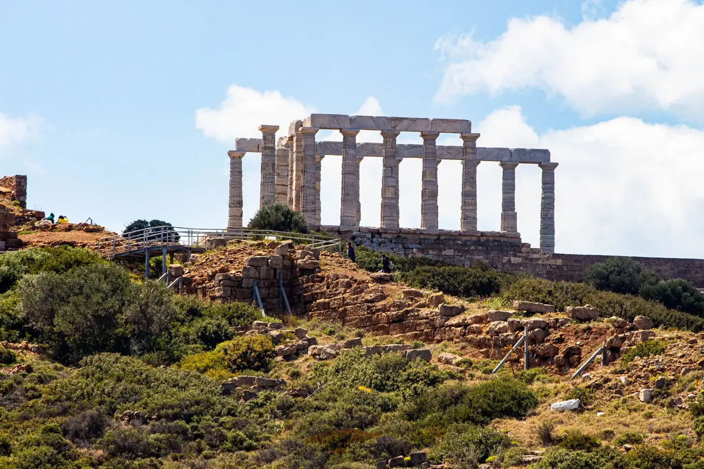 Explore the ancient Temple of Poseidon at Cape Sounion, Greece, with stunning coastal views.