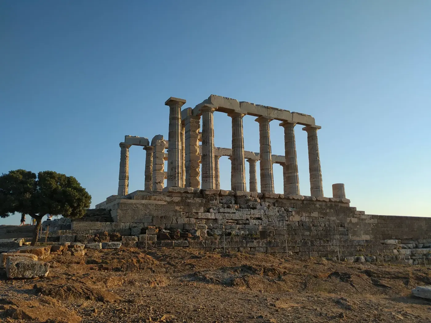 Explore the ancient ruins of the Temple of Poseidon in Sounion, Greece, captured at sunset.