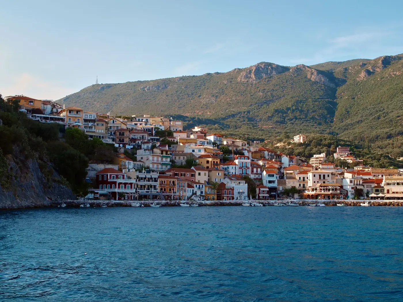 Explore the charming coastal town of Parga, Greece, nestled between sea and hills.