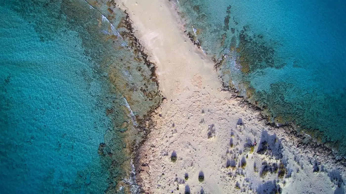 Stunning aerial shot of Simos Beach with turquoise waters and white sand, Elafonisos, Greece.