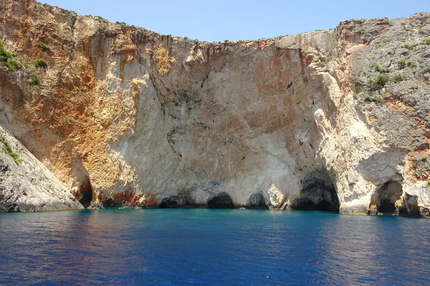 Breathtaking view of coastal cliffs and caves at Zakynthos Island, Greece. Perfect for summer travel and adventure.