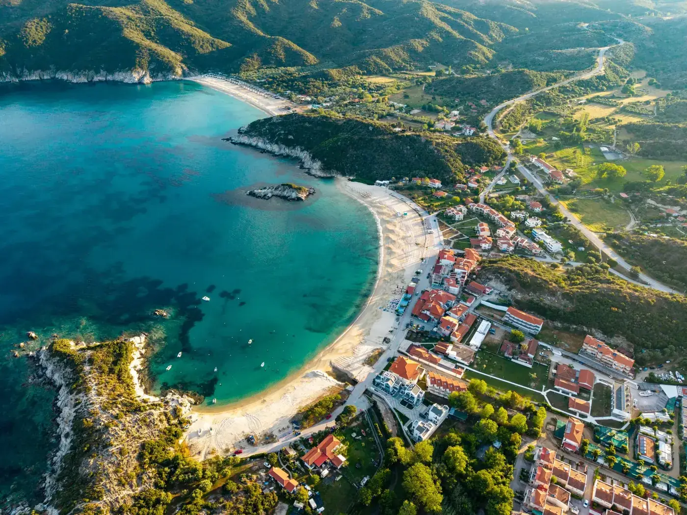 Explore the scenic beauty of Kalamitsi Beach, a stunning coastal paradise in Sithonia, Greece.