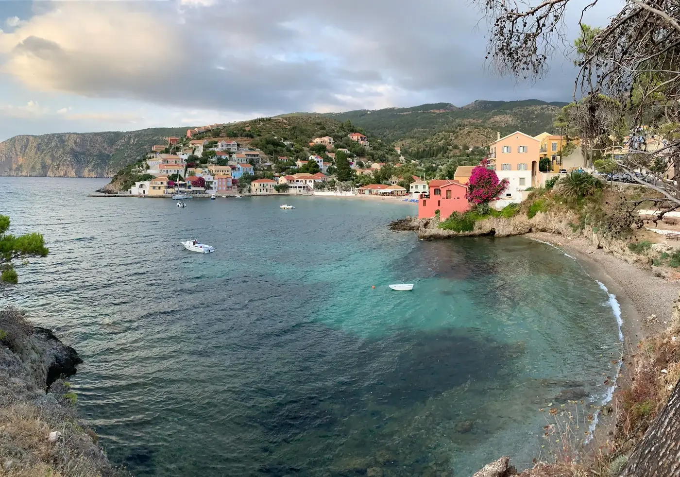 A picturesque view of Asos village in Greece, featuring vibrant houses along the serene coastline.